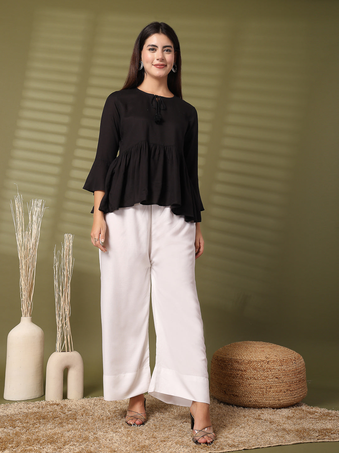 White solid rayon straight palazzo with wide leg fit and elasticated waistband.