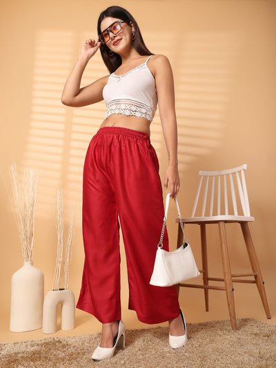 Maroon solid rayon straight palazzo with elasticated waistband and wide leg fit.