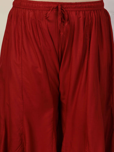 Women solid marron flared rayon sharara with elasticated waistband and drawstring closure.