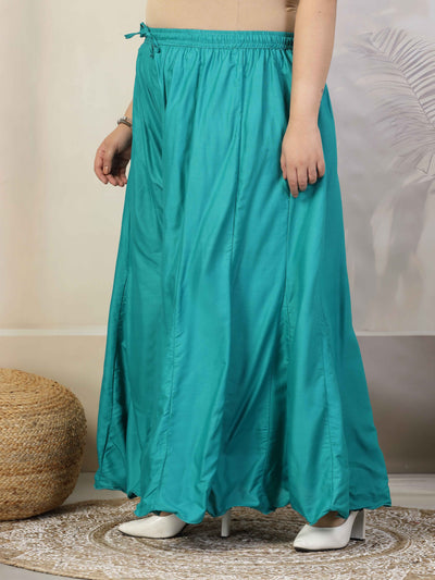 Women solid rama green flared rayon sharara with elasticated waistband and drawstring closure.