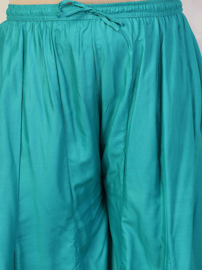 Women solid Rama green flared rayon sharara with elasticated waistband and drawstring closure.