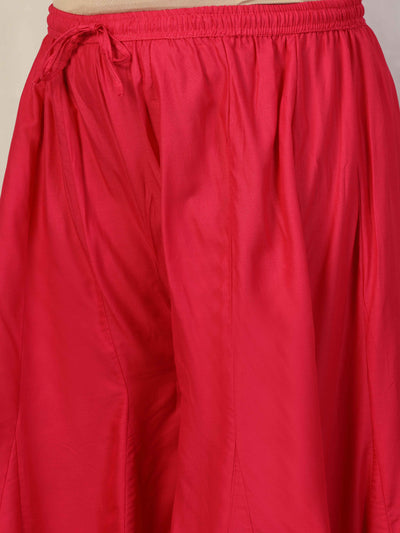 Women solid red flared rayon sharara with elasticated waistband and drawstring closure.