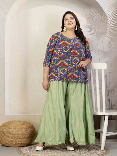 Women solid pista green flared rayon sharara with elasticated waistband and drawstring closure.