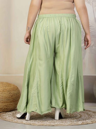 Plus size pista green flared rayon sharara with elasticated waistband and drawstring.