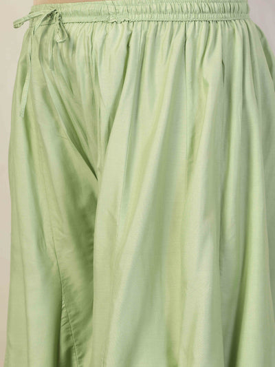 Women solid pista green flared rayon sharara with elasticated waistband and drawstring.