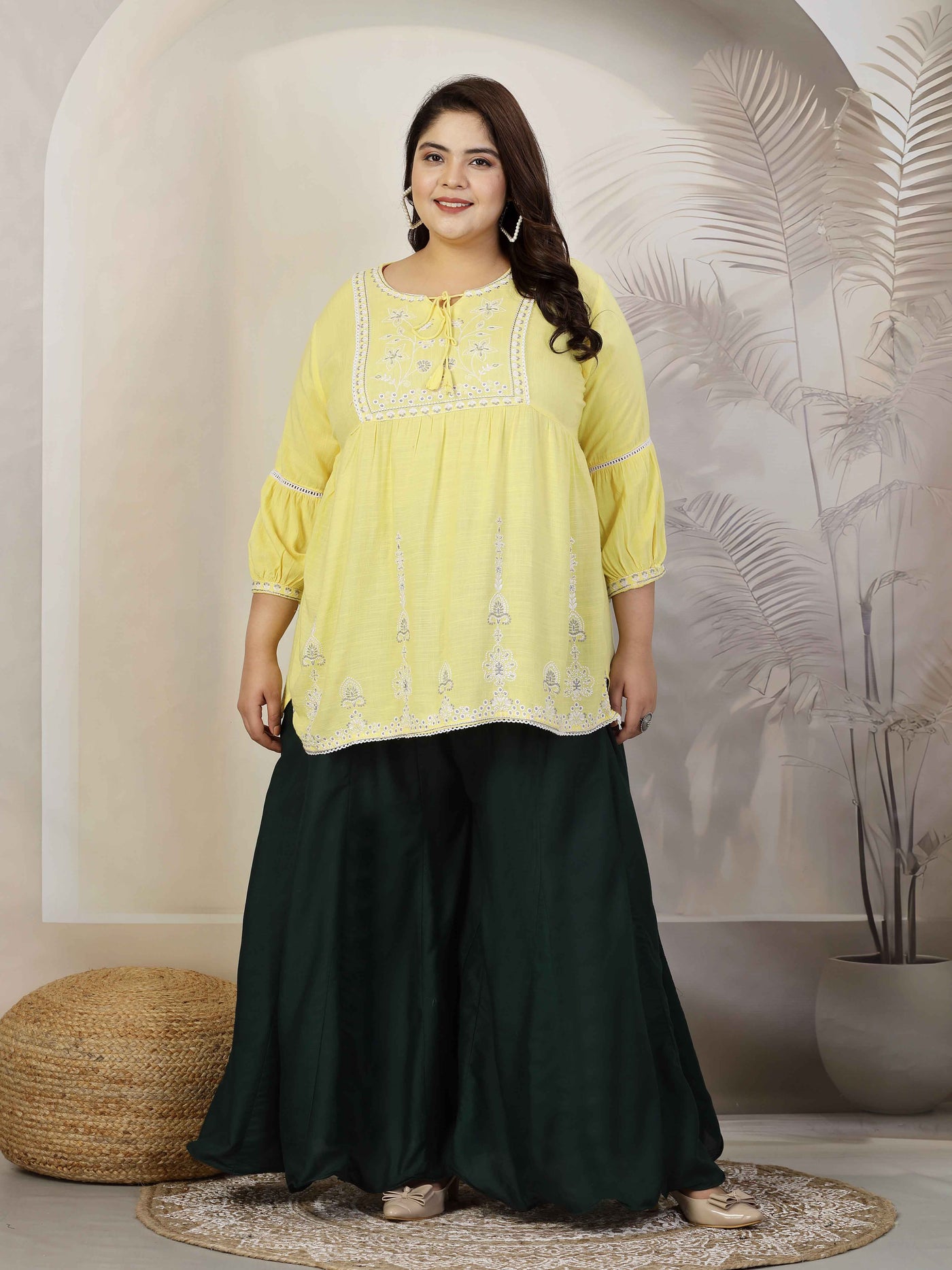 Plus size women solid bottle green flared rayon sharara with elasticated waistband and drawstring closure.