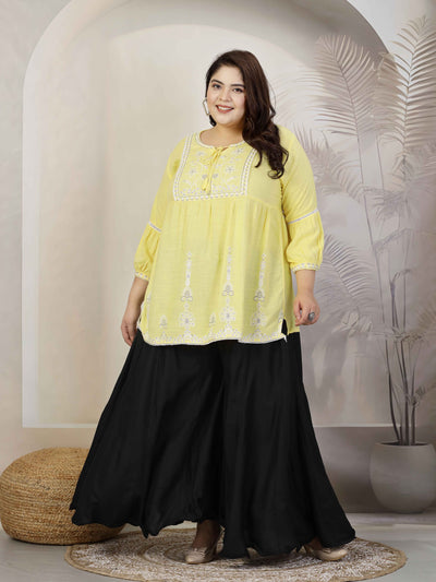 Women solid black flared rayon sharara with elastic waistband and drawstring closure.