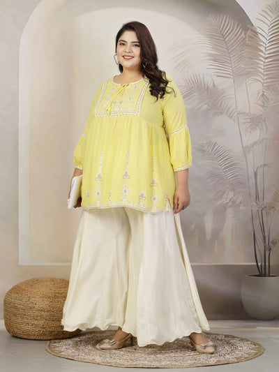 Plus size women solid cream flared rayon sharara with elasticated waistband and drawstring closure.