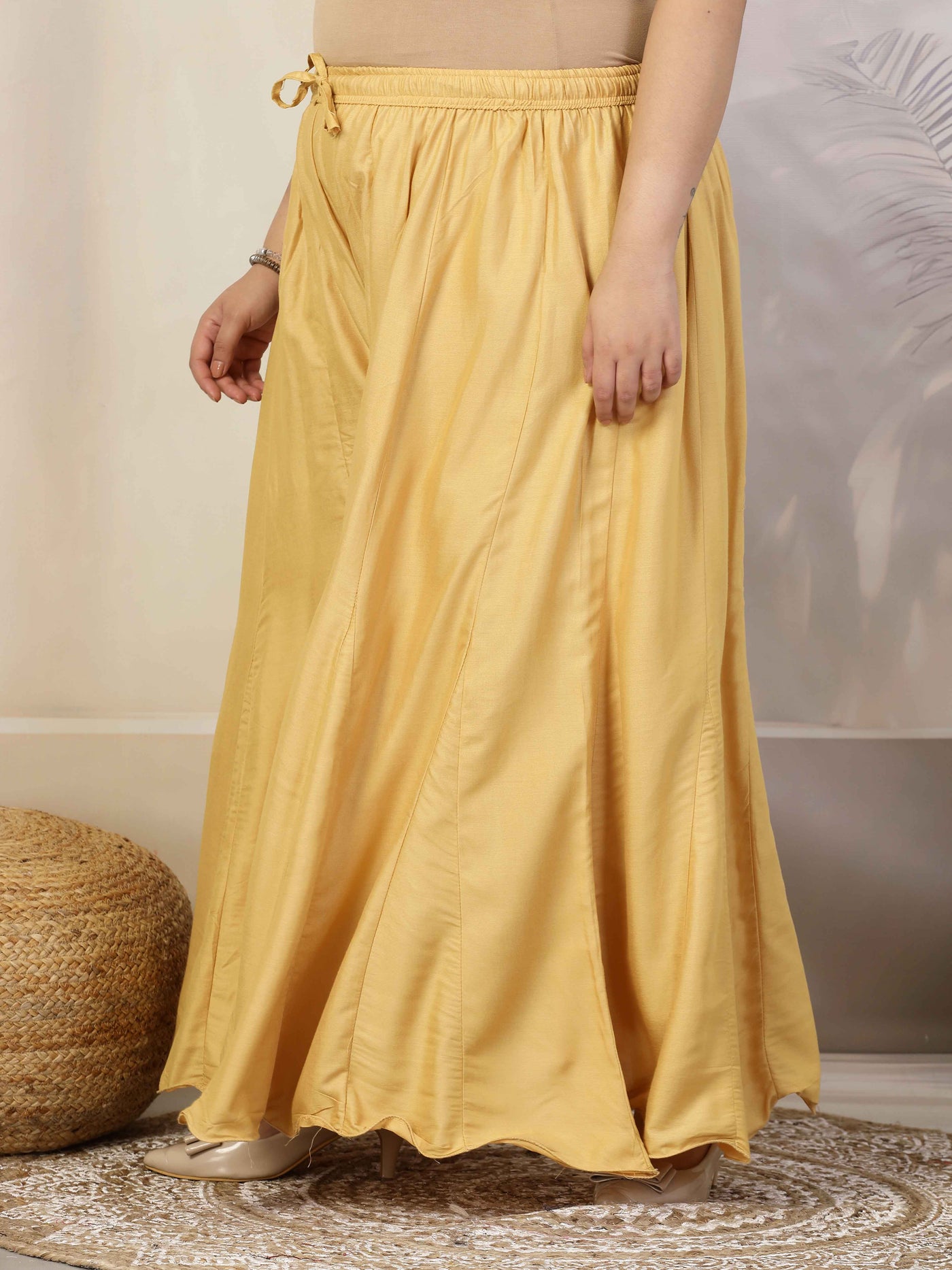 Women Solid Fawn Flared Rayon Sharara with Elastic Waistband and Drawstring.