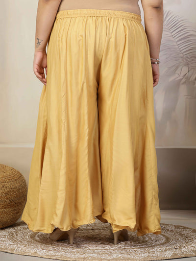 Women solid fawn flared rayon sharara with elasticated waistband.