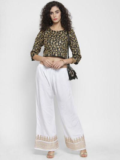 White Gotta Patti Rayon Palazzo with elasticated waistband and flared cut.