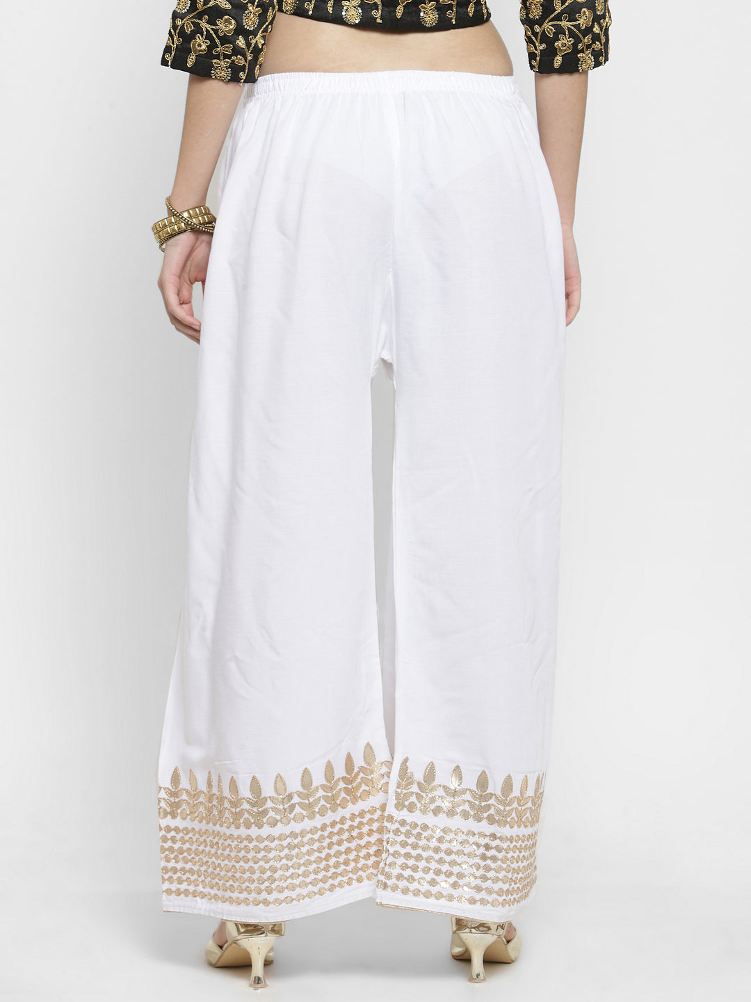 White rayon palazzo with gold Gotta Patti hem and elastic waistband.