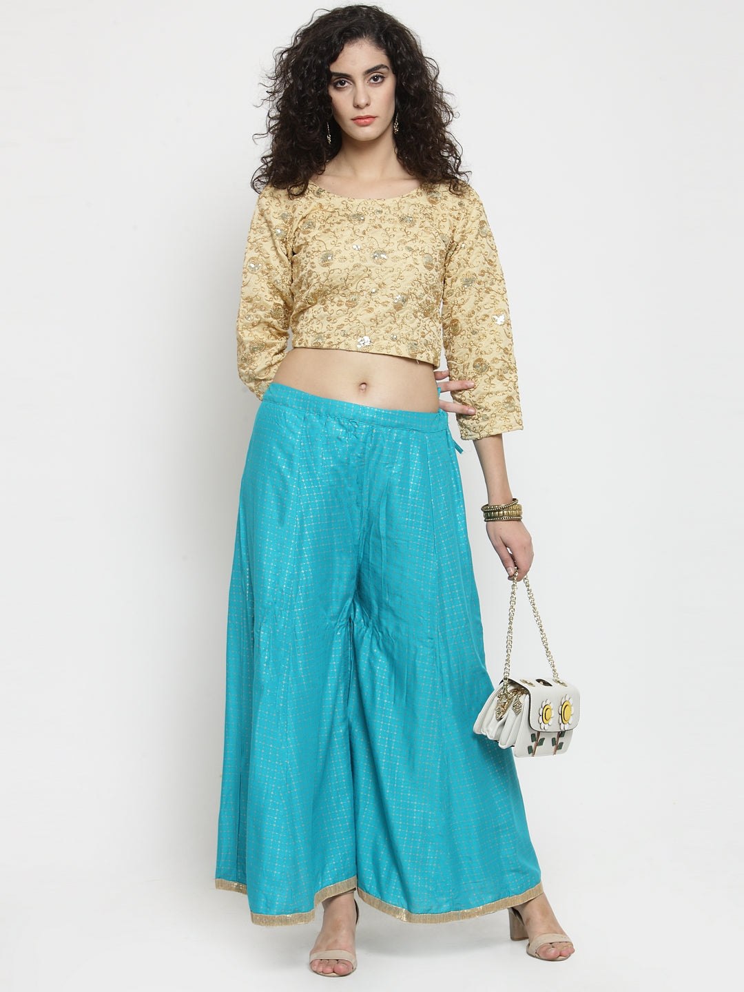 Turquoise printed rayon wide leg palazzo with ethnic design.