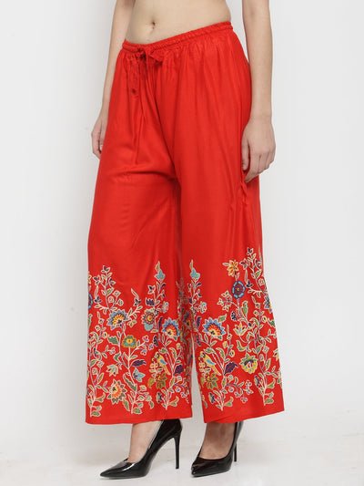 Red printed rayon palazzo with floral design and elastic waistband.