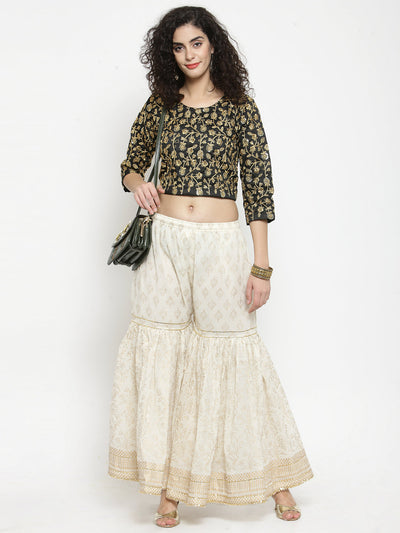 Off-White printed gharara with gold Gotta Patti detailing and flared cut.