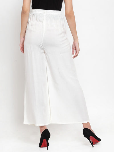 White wide leg solid palazzo pants with tie knot detail.