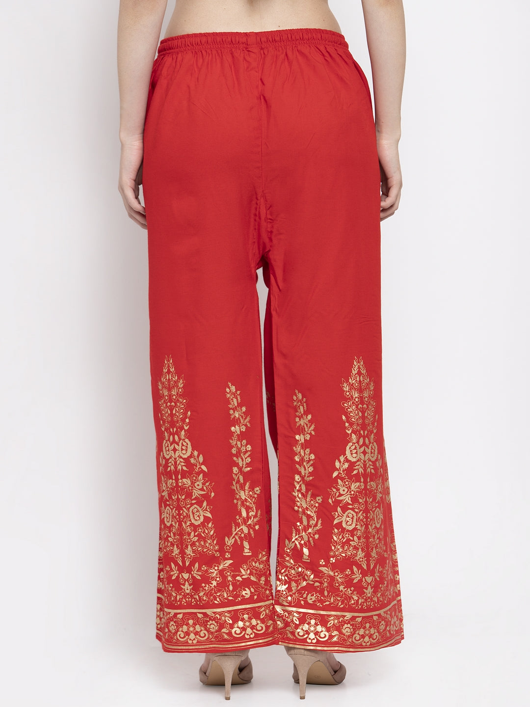 Red straight printed rayon palazzo with golden design and elastic waistband.