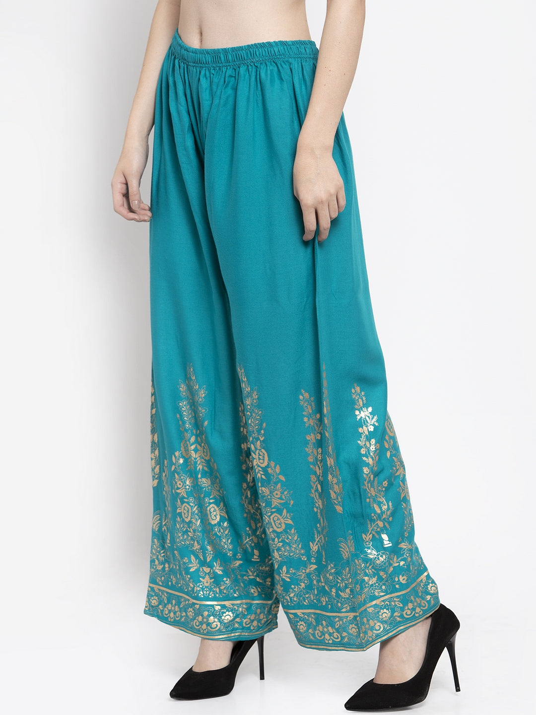 Turquoise straight printed rayon palazzo with elasticated waistband.