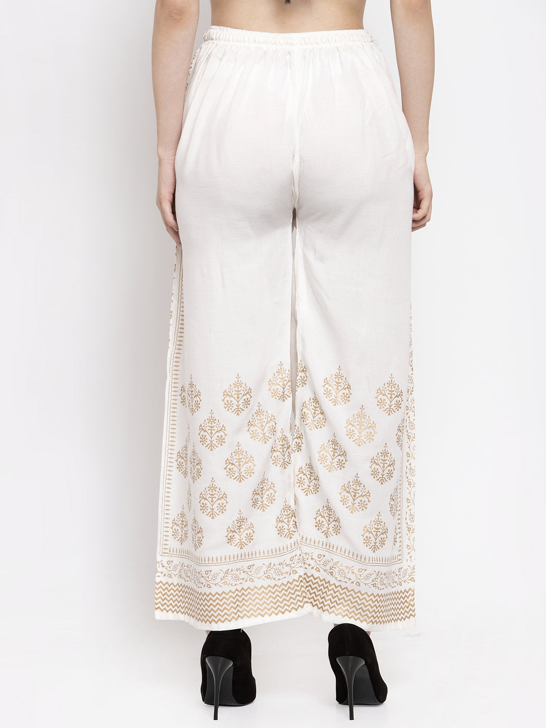 Off-White Rayon Palazzo with printed design and elastic waistband.