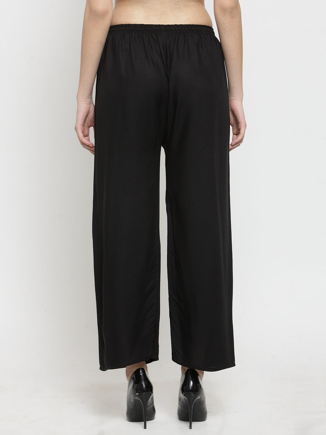 Solid black rayon palazzo pants from Clora Creation showcasing back view.