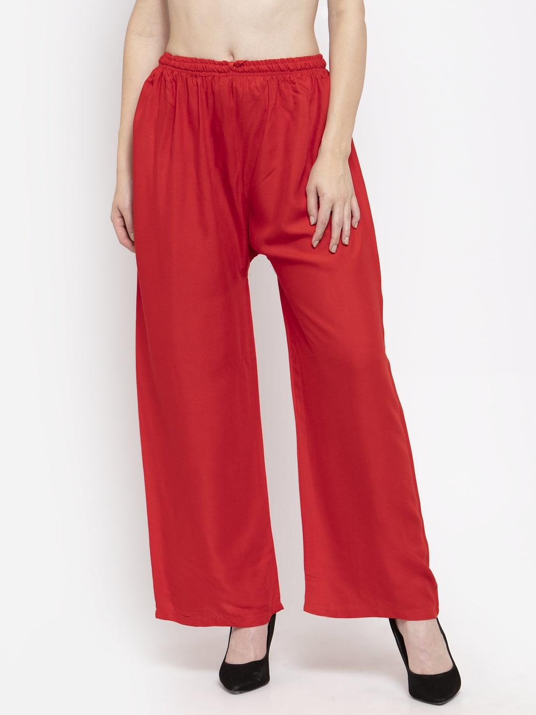 Solid red rayon palazzo pants with elasticated waistband and drawstring.