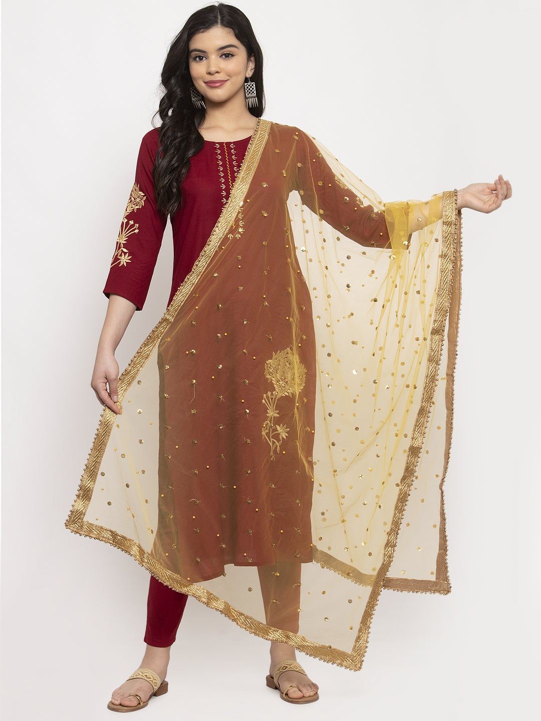 Yellow heavy gotta patti net dupatta styled with kurta set.