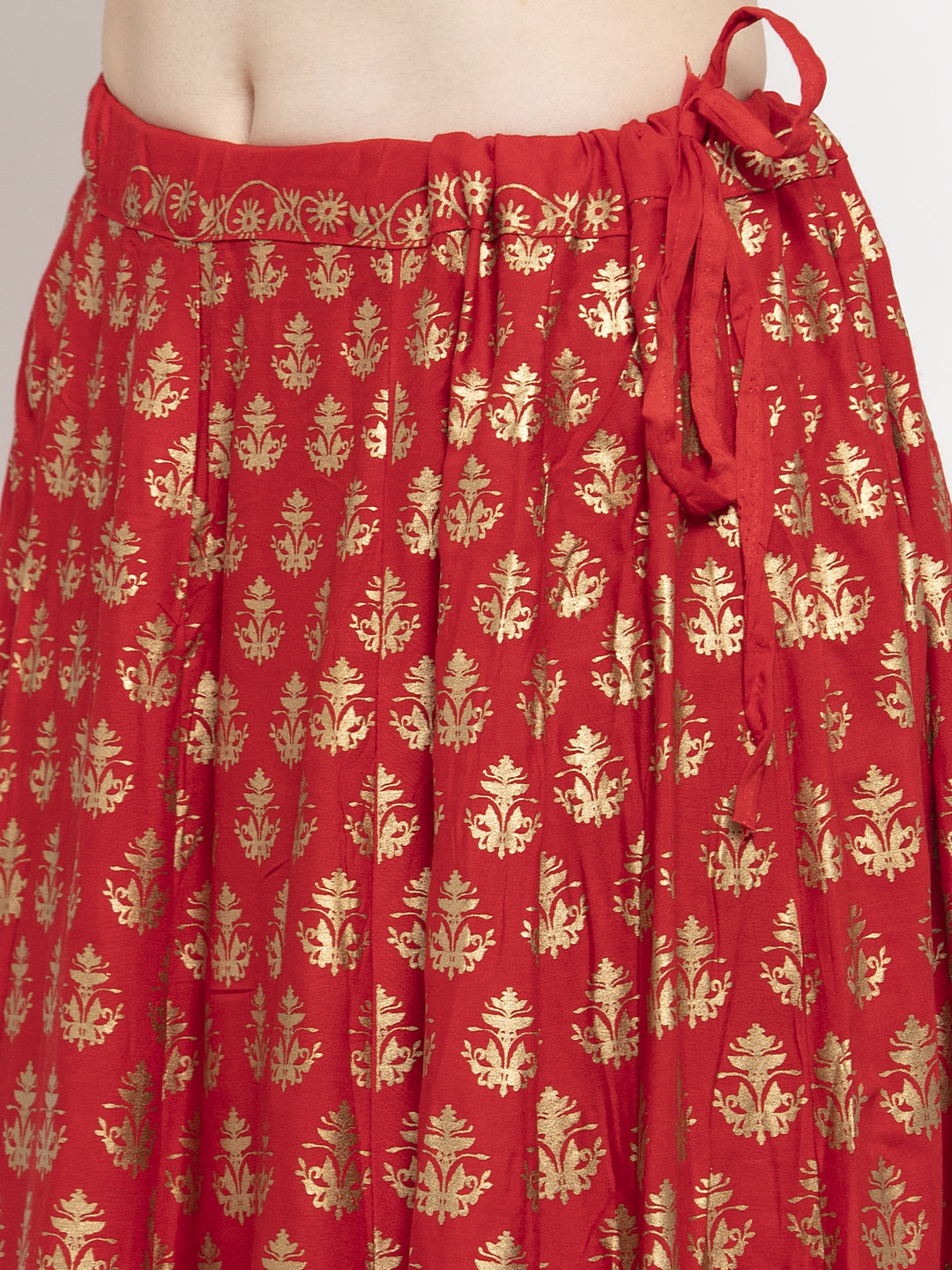 Red floral printed rayon skirt with gold pattern detail.