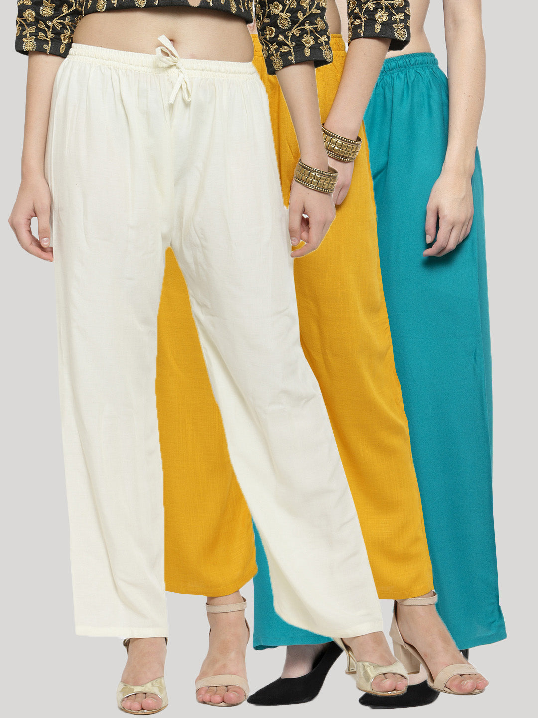 Solid off-white, mustard, and turquoise rayon palazzo pants pack of 3 with elastic waistband and drawstring closure.