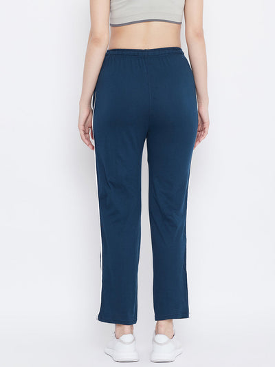 Teal straight fit trackpants for women in hosiery fabric.