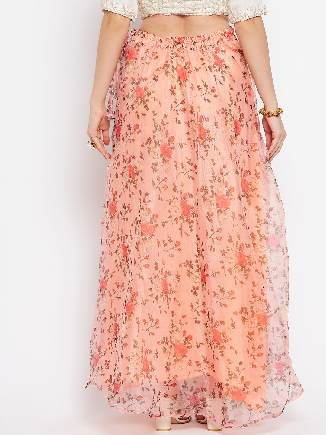 Peach floral printed organza skirt with flared hem and zip.