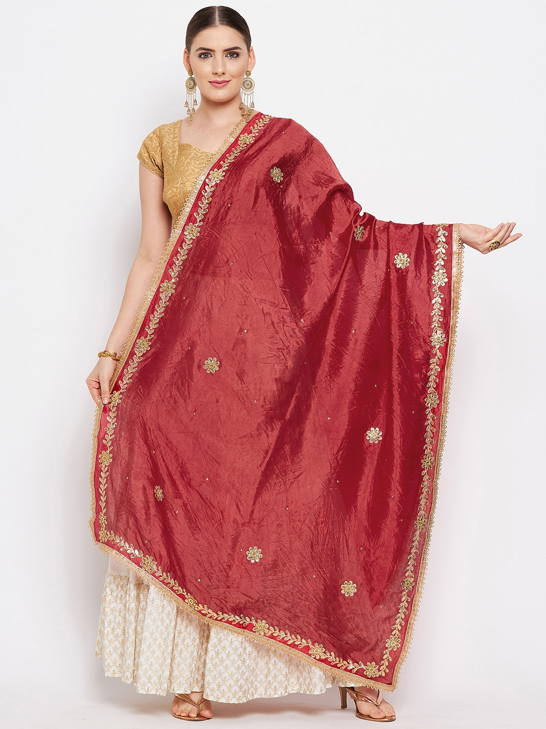 Red embellished silk blend dupatta styled with ethnic attire.