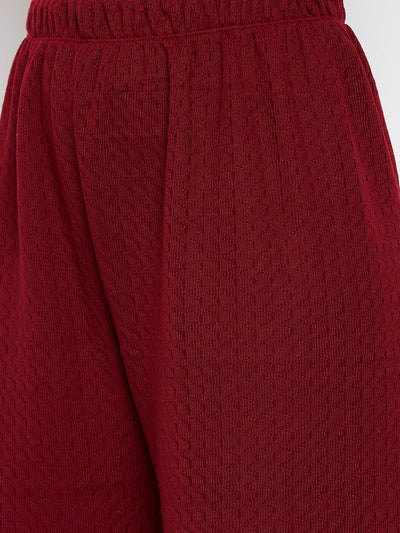 Maroon Solid Woolen Palazzo with textured fabric detail.