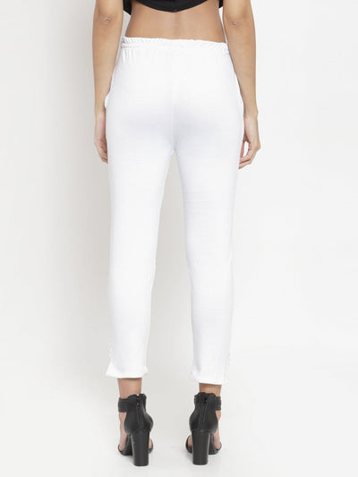 White solid woolen trouser for women, rear view, paired with black heels.