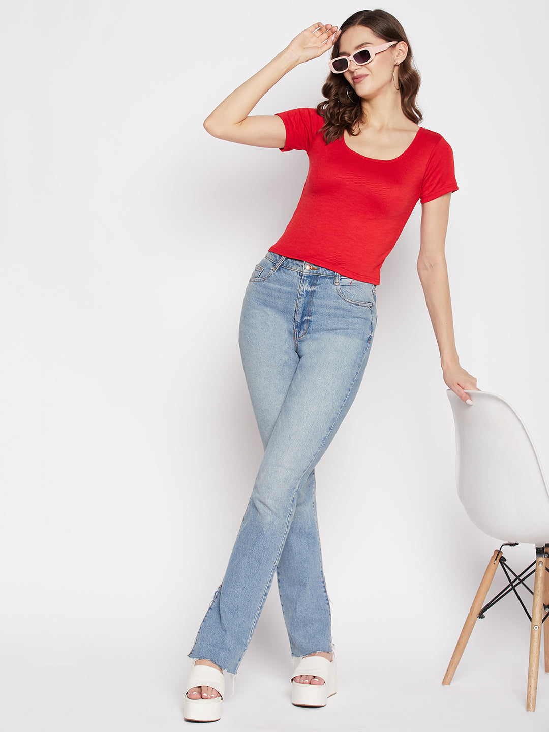 Red solid regular fit crop top with round neck and cap sleeves.