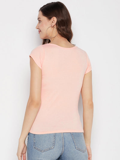 Peach solid regular fit crop top with cap sleeves and round neck, casual wear.