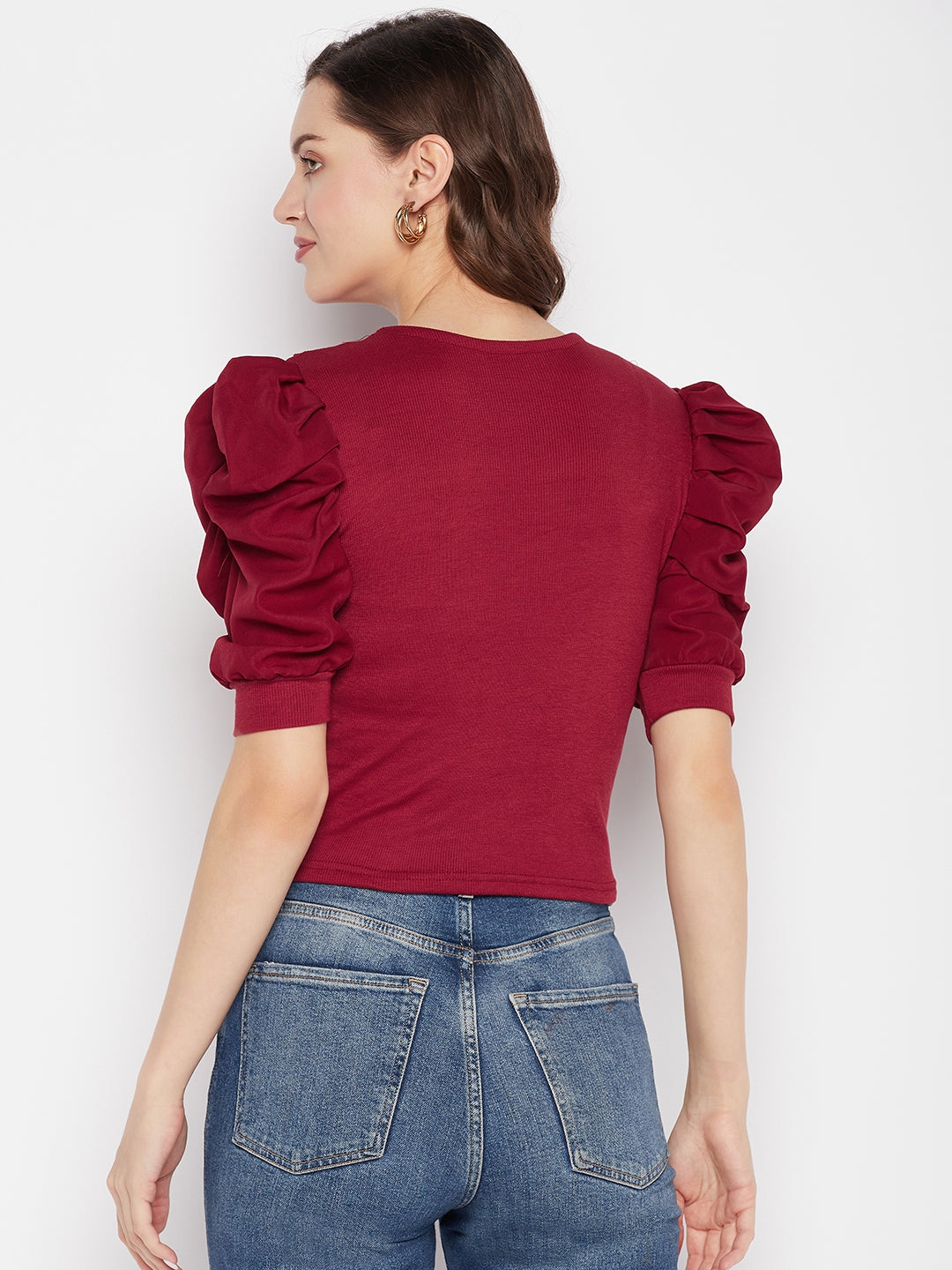 Maroon solid puff sleeves crop top with tie knot collar and casual knitted design.