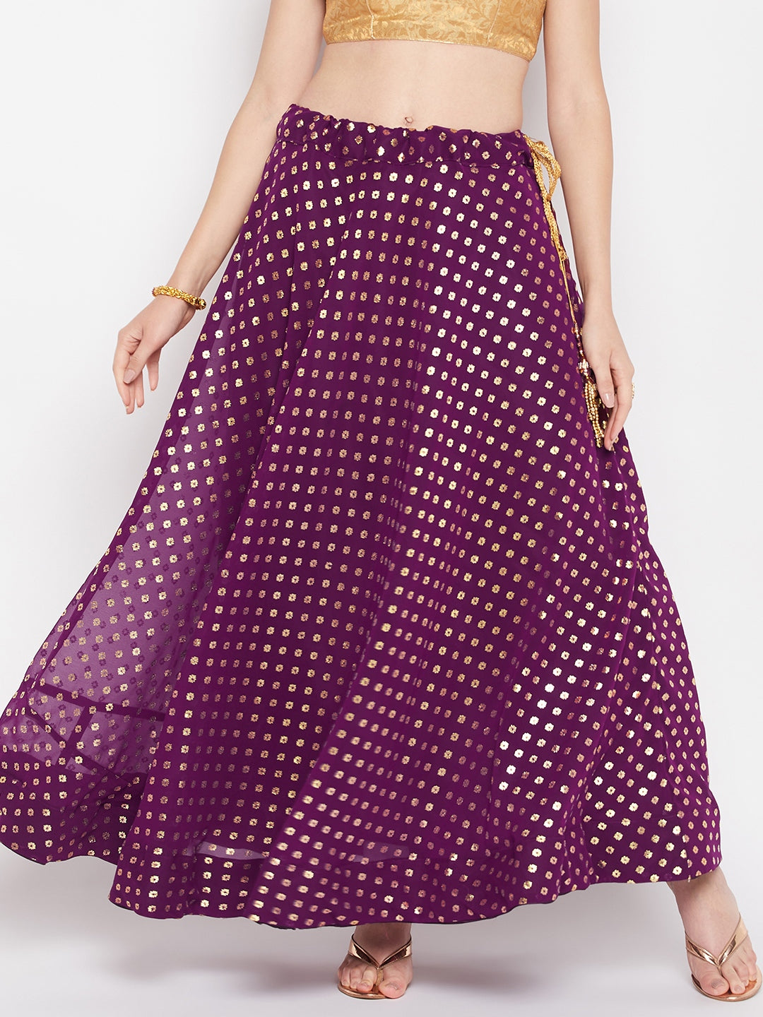 Wine printed georgette flared skirt with foil print and drawstring closure.