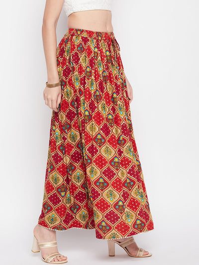 Red printed rayon maxi skirt with geometric foil design, elasticated waistband, drawstring closure, and flared hem with gotta work detailing.