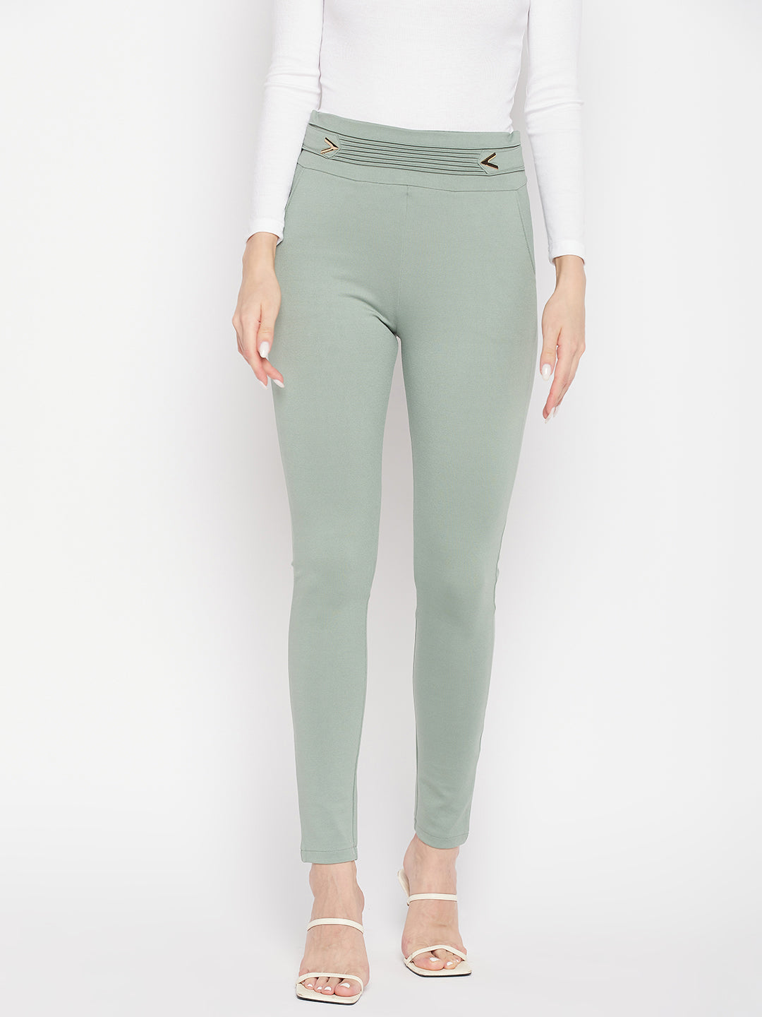 Pista Green Solid Regular Fit Jeggings with elasticated waistband and front pockets.