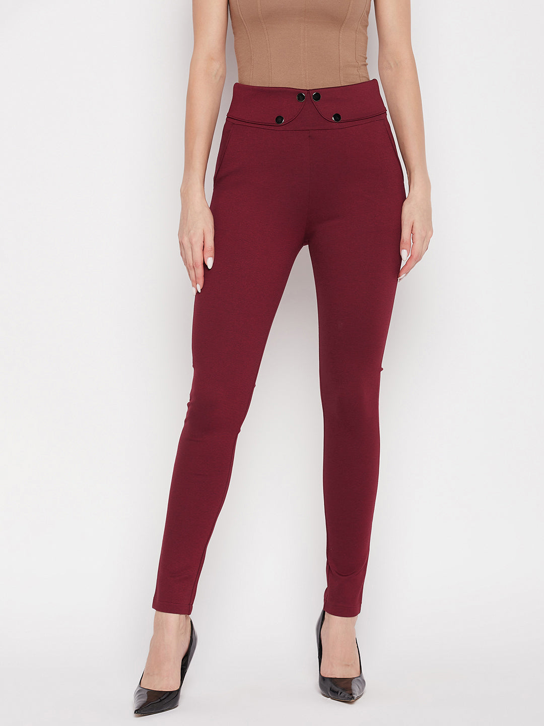 Maroon solid relaxed fit jeggings with elastic waistband and front pockets.