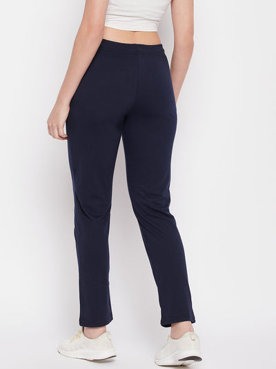 Navy blue solid mid rise cotton track pants with elasticated waistband and drawstring closure.