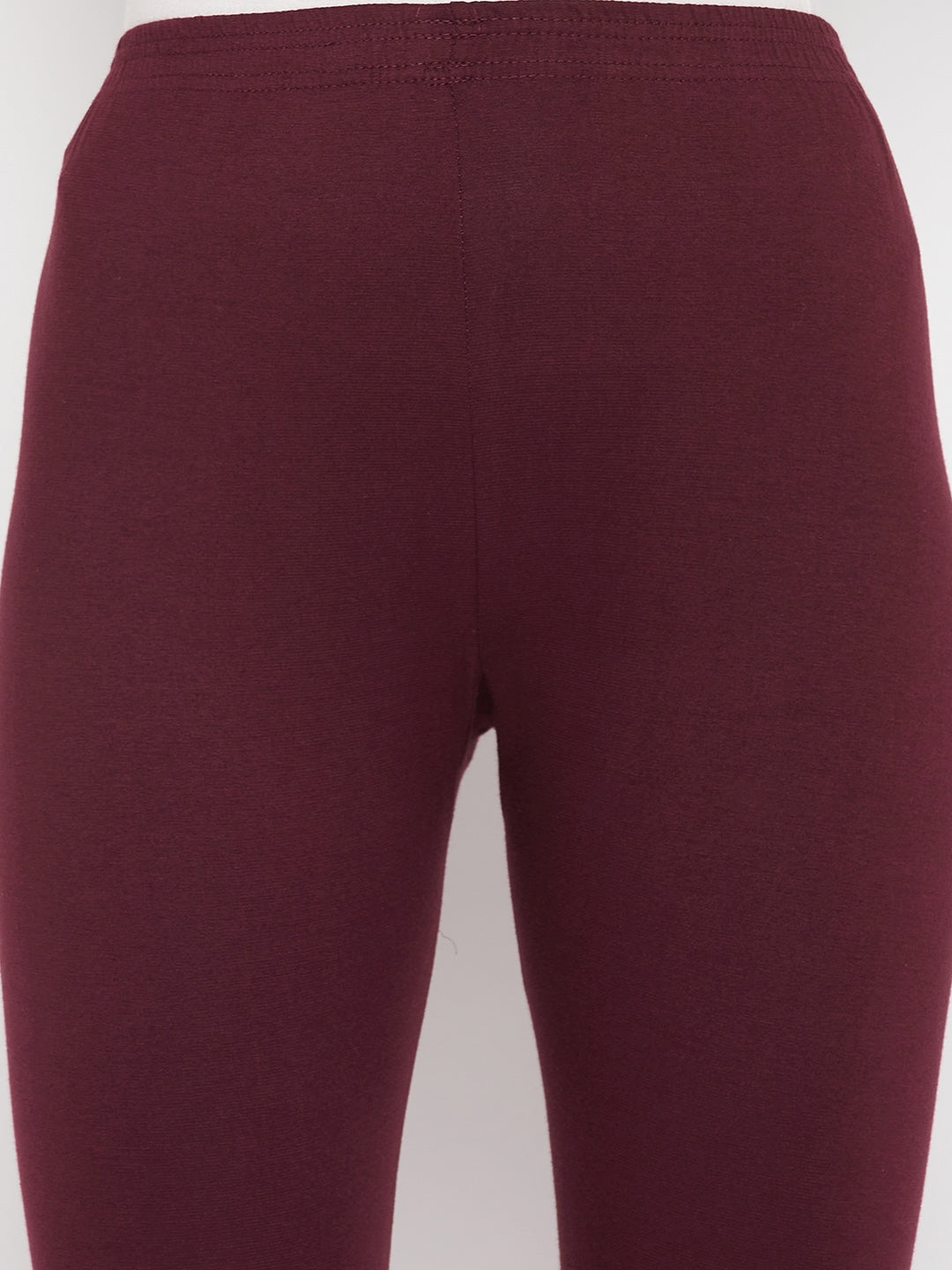 Wine solid ankle length leggings with elastic waistband.