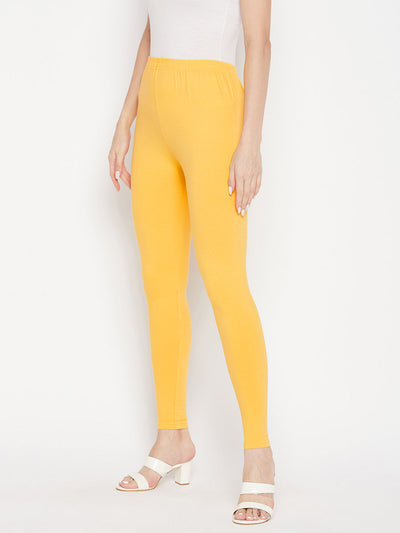 Yellow solid ankle length leggings with elasticated waistband.