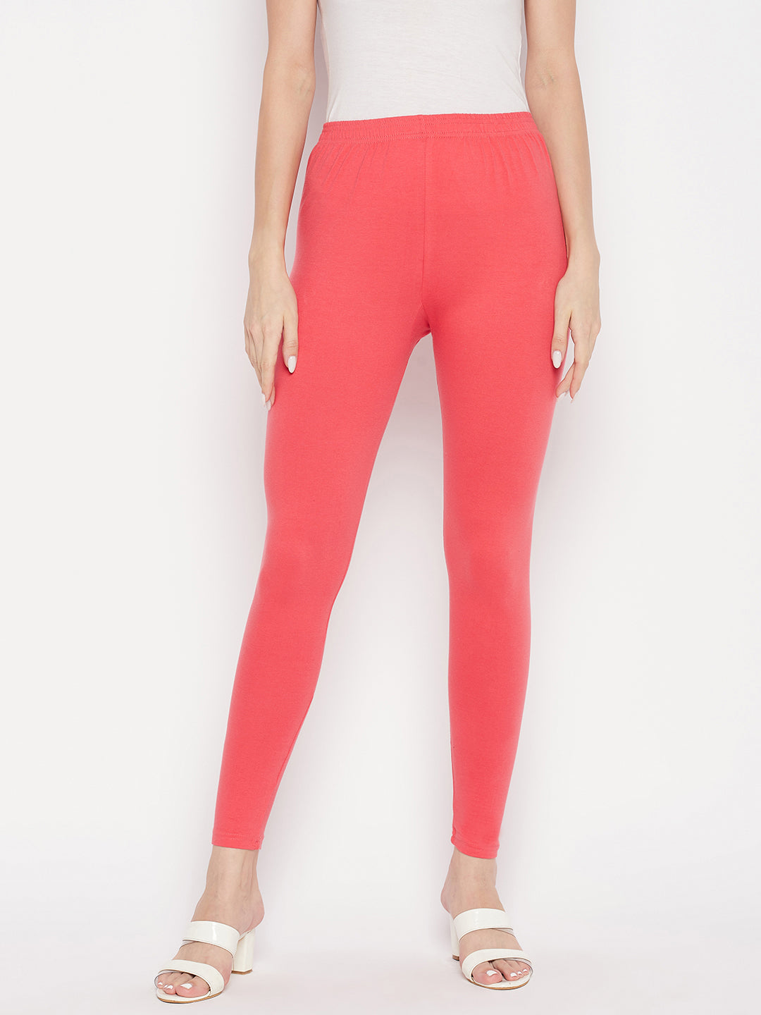 Pink solid ankle length leggings with elasticated waistband.