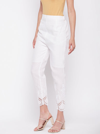 White solid cotton embroidered ankle-length pant with partially elasticated waistband.