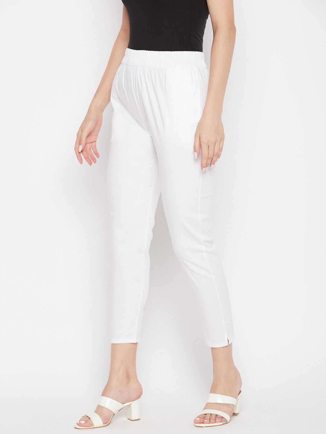 White solid cotton lycra pant with elastic waistband and ankle length.