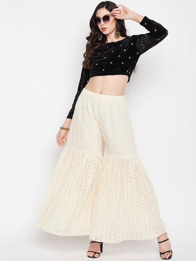 Off-white Chikankari cotton flared gharara with elasticated waistband and drawstring.