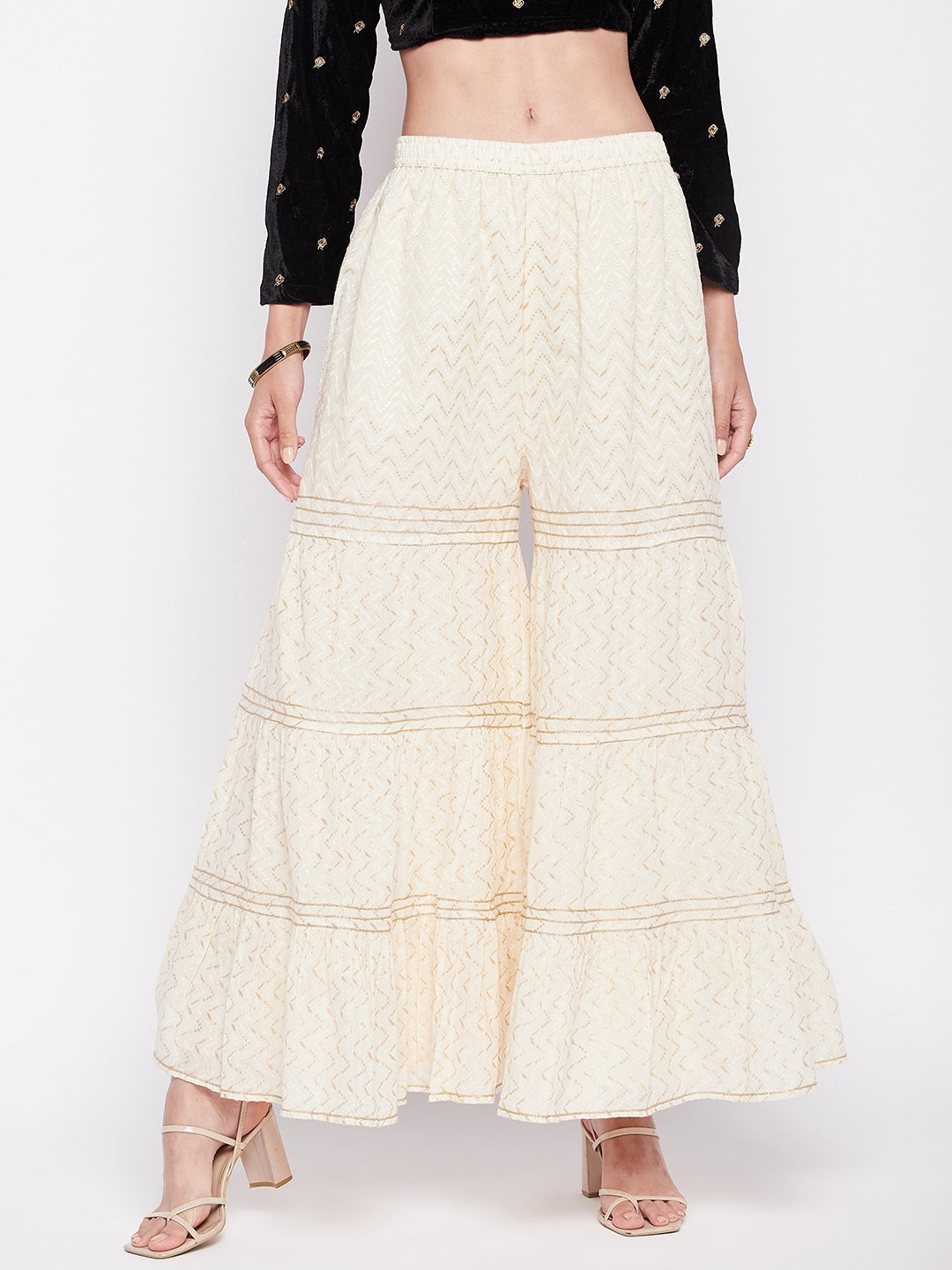 Off-white self-design cotton flared gharara with elasticated waistband and lining.