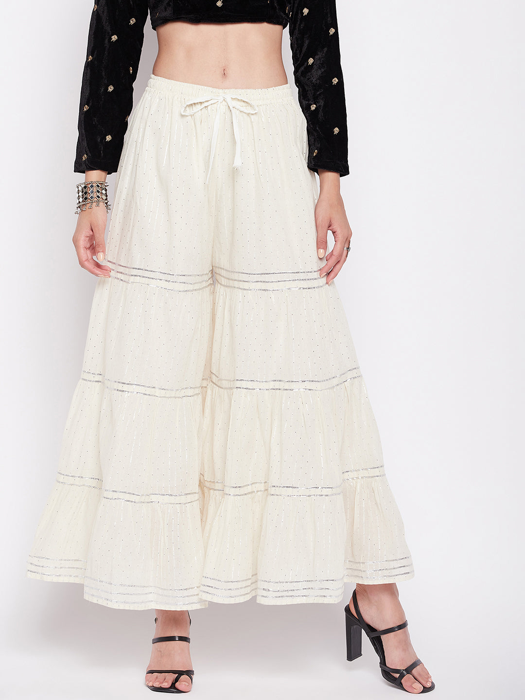 Off-White silver lurex embellished cotton gharara with elasticated waistband and flared hem.