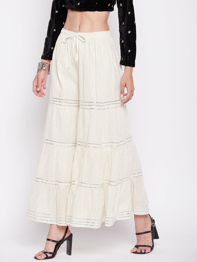 Off-White Silver Lurex embellished cotton gharara with drawstring waistband and flared hem.